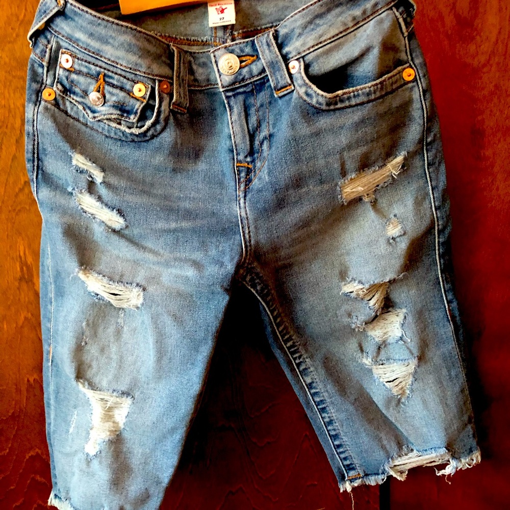 Cutoff distressed True Religion denim shorts
